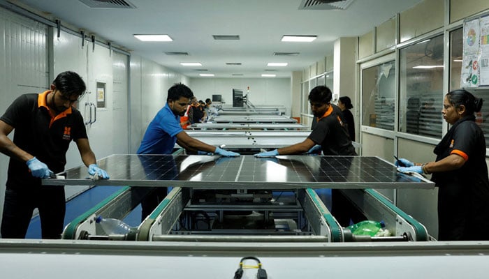 Technicians work on the assembly line in a solar manufacturing hub in Greater Noida, on the outskirts of New Delhi India on Oct 23, 2024. — Reuters