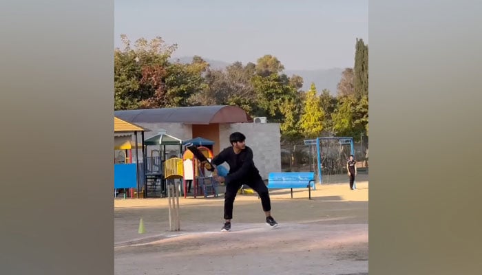 This still taken from a reel shows a boy taking a shot during a cricket match on the occasion of the Millennial Olympiad 2024 on February 18, 2024. — Facebook/RootsMillenniumSchools/file