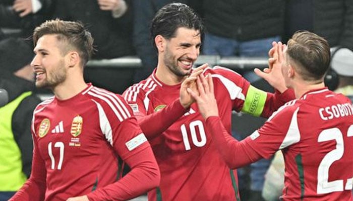 Hungarys midfielder Dominik Szoboszlai (centre) celebrates scoring the goal from the penalty spot with his teammates during the Uefa Nations League Group A3 football match against Hungary at the Puskas Arena in Budapest, Hungary, on Tuesday. — AFP/file