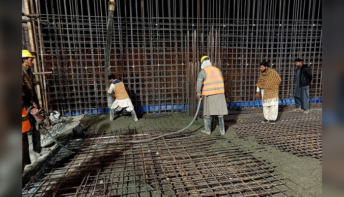 This representational image shows labourers pouring cement at a construction site on November 20, 2024. — Facebook@CBDPunjab