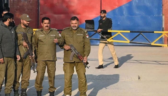 This image shows Punjab police personnel standing alert outside a jail. — AFP/File