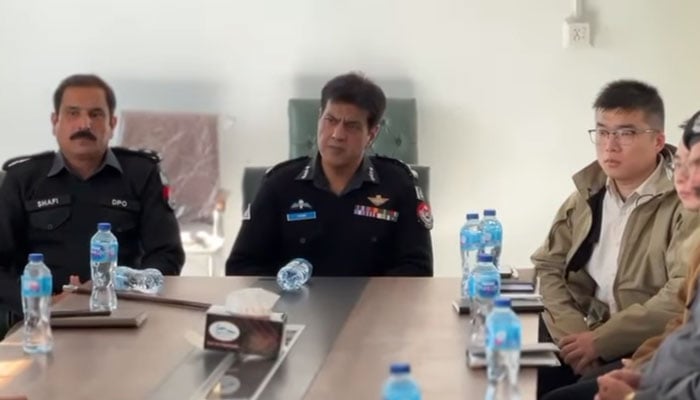 DIG of Police Hazara Range, Tahir Ayub Khan (centre), sits in a meeting at the Chinese project site in Mansehra on November 19, 2024. — Screengrab via Facebook@hazarapolice