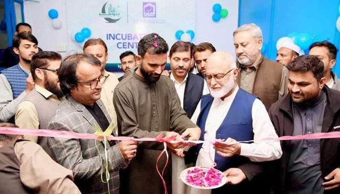 International cricketer Fakhar Zaman cuts a ribbon to inaugurate the first IT centre in Nishtarabad on November 20, 2024. — Facebook@alkhidmat.org