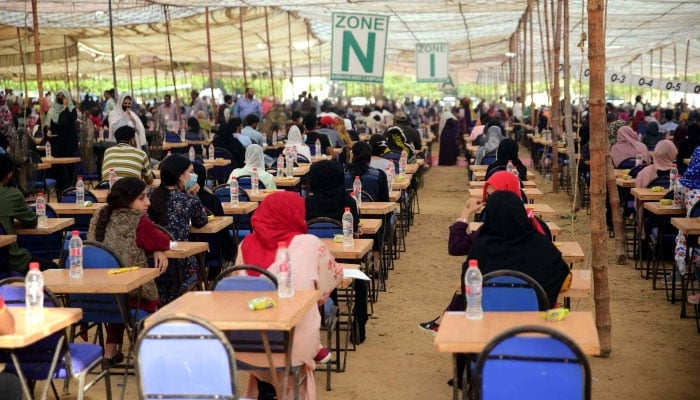 Students solve their questionnaire during the Medical and Dental College Admission Test (MDCAT) held at NED University in Karachi on November 13, 2022. —PPI