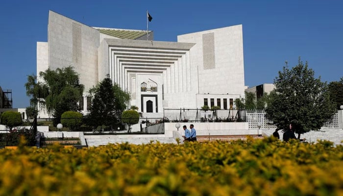 Police officers walk past the Supreme Court building in Islamabad. — Reuters/File