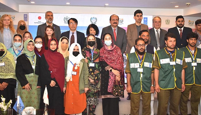 Chairman of the Prime Minister’s Youth Programme Rana Mashood in a group photo with percipients during a market-driven vocational and technical skills training programme ceremony organised by the Government of Japan, the UNDP and Sarhad Rural Support Programme on November 21, 2024. — INP