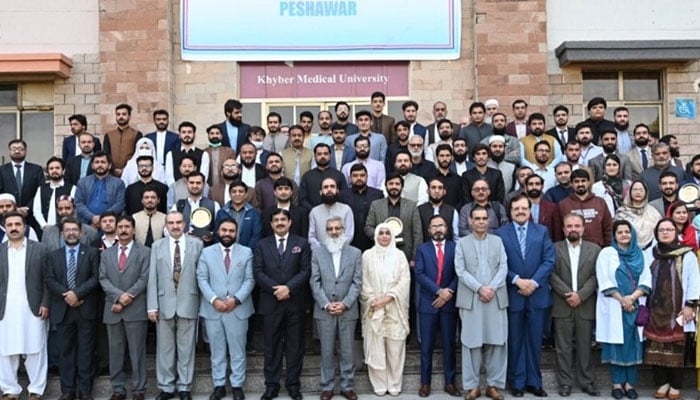 The KMU officials and students pose for a group photo during an awards ceremony at Khyber Medical University (KMU) on November 20, 2024. — Facebook@kmupeshawarofficial