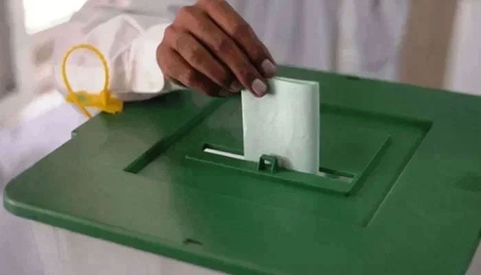 This representational image shows a man casting his vote in the ballot box. — AFP/File