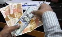 Rupee ends higher against dollar