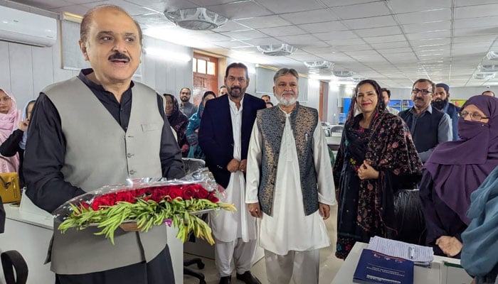 Education Secretary Mohyuddin Ahmed Wani (left) speaks with participants during the closing ceremony for the American Board for Certification of Teacher Excellence training programme on November 22, 2024. — Facebook@mofept