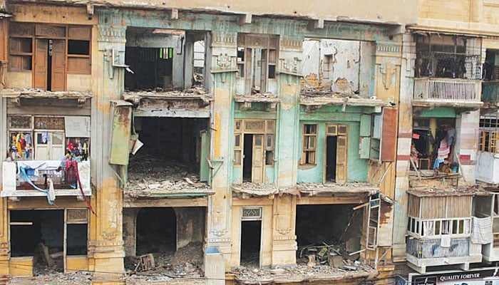 The representational image shows dilapidated buildings in Karachi. — PPI