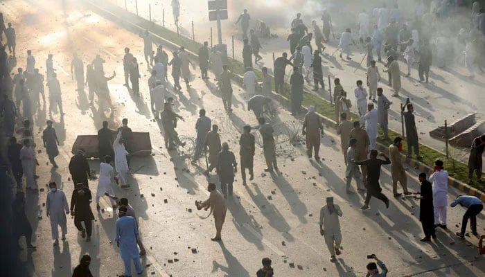 Supporters of former prime minister Imran Khan participate in a protest against his arrest, in Peshawar, May 9, 2023. — Reuters