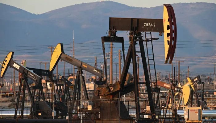 A representational image showing oil pump jacks can be seen operating at an oil field. — AFP/file