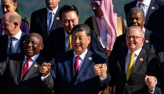 Cyril Ramaphosa (left) Chinese President Xi Jinping, and Australian Prime Minister Anthony Albanese (right) pose with other G20 leaders during an event launching the Global Alliance Against Hunger and Poverty at the G20 Summit at the Museum of Modern Art in Rio de Janeiro, Brazil on Monday, November 18, 2024. — Reuters