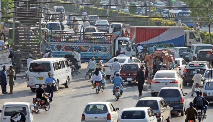 Motorists face difficulties due to the road being closed with dumpers at Murree Road Faizabad area in Rawalpindi on October 18, 2024. — Online