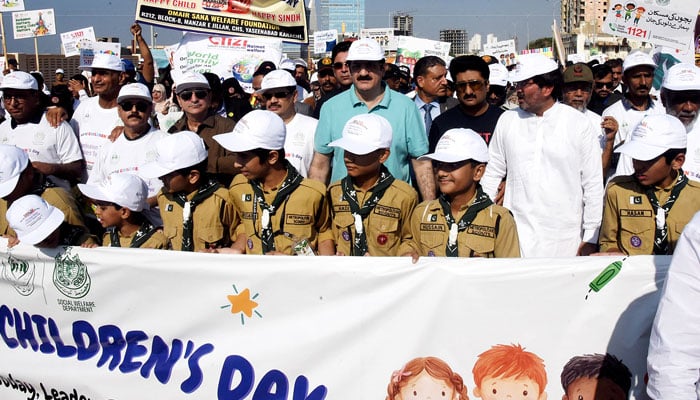 On World Childrens Day, Sindh Chief Minister Syed Murad Ali Shah (centre) leads a walk to highlight childrens rights and collective responsibility for their well-being at Nishan-e-Pakistan, Karachi, on November 23, 2024. — NNI,