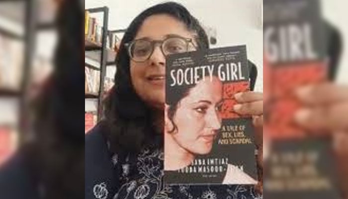 Writer-Journalist Tooba Masood Khan holding a copy of ‘Society Girl: A Tale of Sex, Lies, and Scandal’, co-authored with fellow journalist Saba Imtiaz.— Instagram@rolibooks/file