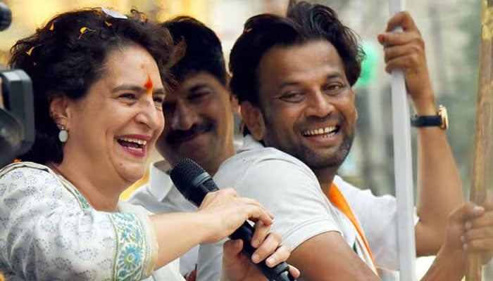 Priyanka Gandhi Vadra (left) addresses the gathering during a roadshow in support of Congress candidate from Nagpur Central seat.— ANI/file