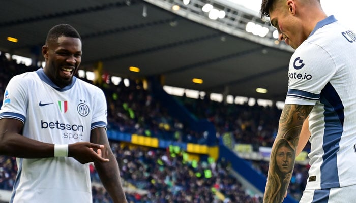 Joaquin Correa (right) and Marcus Thuram in happy mood. — AFP/file