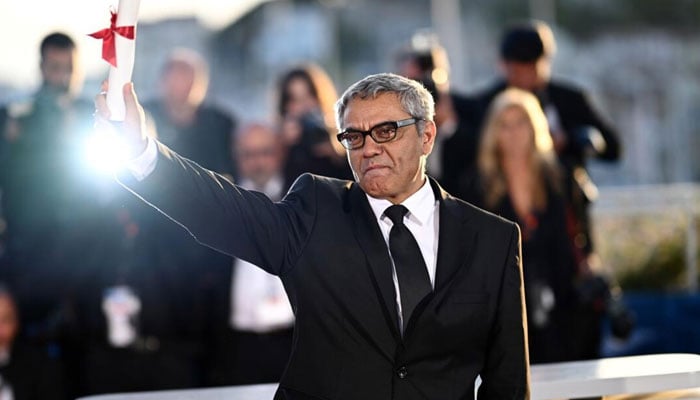 Iranian director and producer Mohammad Rasoulof gestures at the Cannes festival, after daringly fleeing Iran on foot through treacherous mountain passes just days earlier. — AFP/File