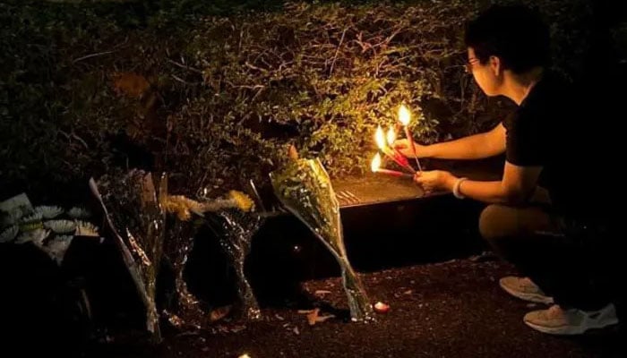 Some Zhuhai residents lit candles on Tuesday evening. — Reuters/file