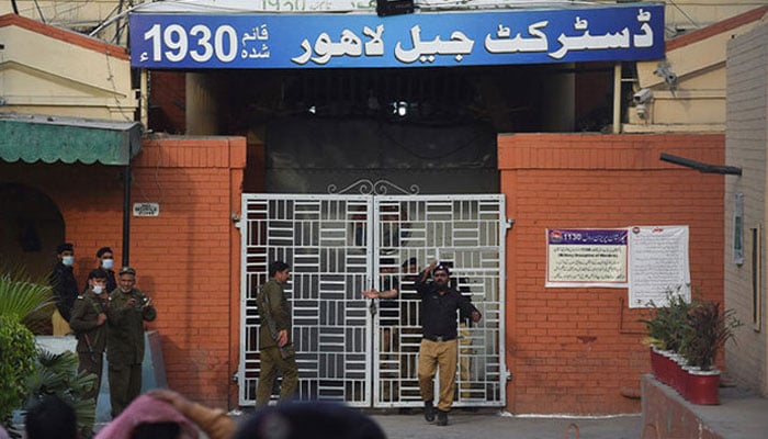 A policeman gestures at the entrance of the District Jail Lahore on March 20, 2021. — AFP/file