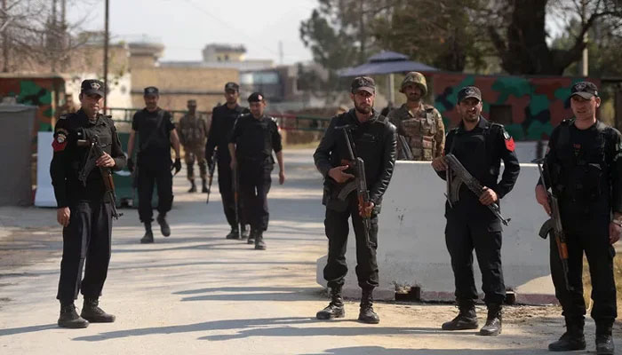 This representational police personnel can be seen standing guard. — AFP/File