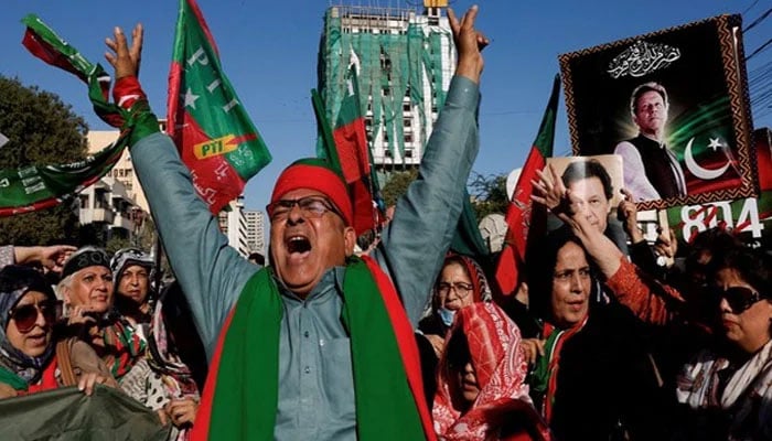 A representational image showing PTI workers and activists raising slogans during a protest rally. — Reuters/File