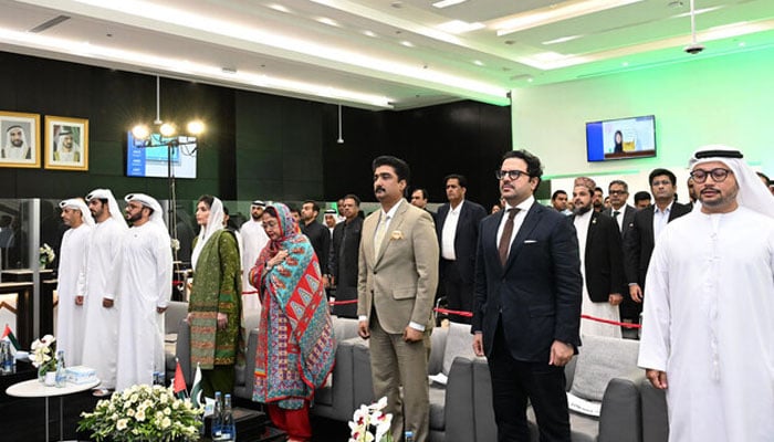 In this handout photograph, taken and released by Pakistan Peoples Party, PPP lawmaker and Pakistan’s First Lady Aseefa Bhutto Zardari (4th from left) gestures with Bakheet Ateeq Al-Remeithi (3rd from right), UAE Consul General Karachi, during an Independence Day ceremony at the UAE Consulate in Karachi on August 13, 2024. — X@PPPDigital