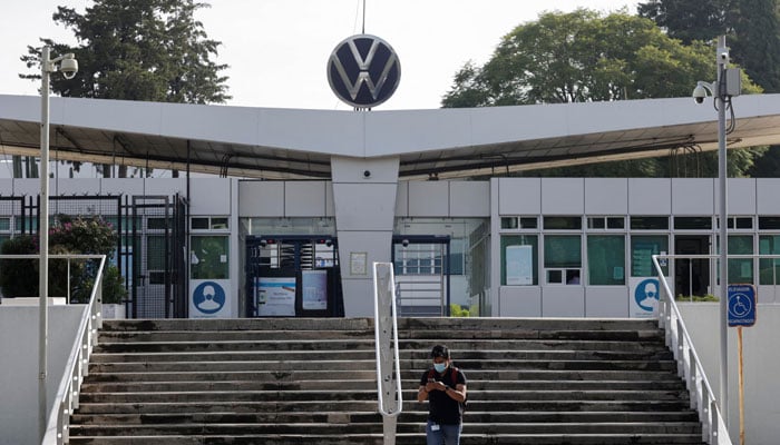 An employee leaves the Volkswagens Mexico factory in Puebla, Mexico August 31, 2022.— Reuters