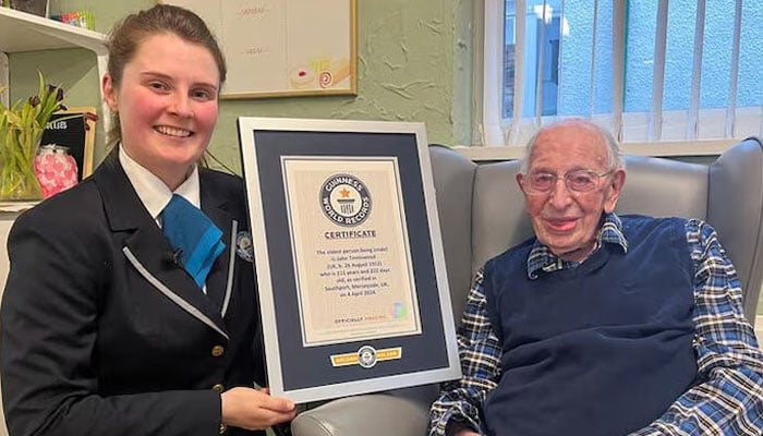 John Tinniswood, 111, poses with his certificate from the Guinness World Records, who announced that he is the worlds oldest living man, in Southport, Britain on April 4, 2024 in this handout image. — Reuters