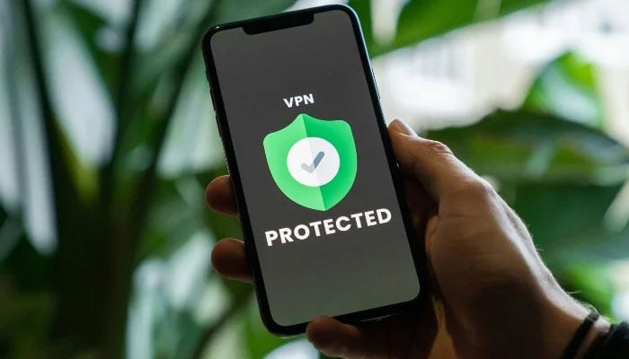 A VPN app logo seen on phone in this representational image. —Unsplash/ File