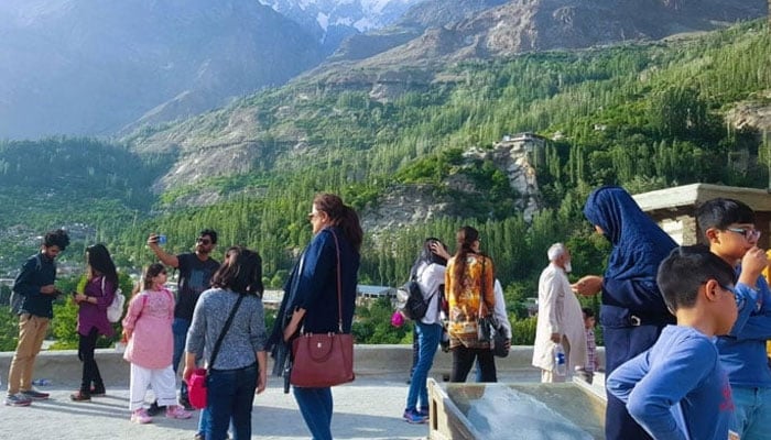 This representational image shows people enjoying the view at a tourist destination in KP. — APP/File