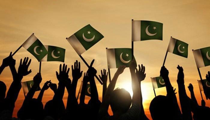 Representational image show people holding Pakistani flag in the air. — TheNews/File