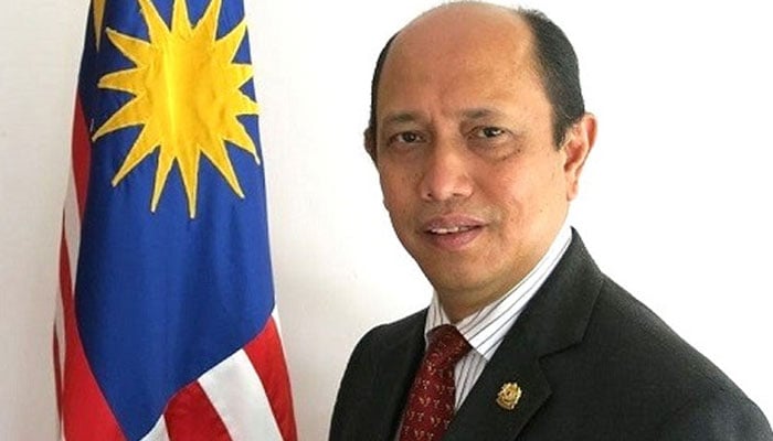 High Commissioner of Malaysia to Pakistan  Mohammad Azhar Mazlan seen in this image with flag. — APP/File