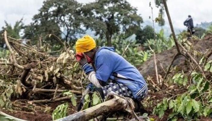 A person mourning at the site of land sliding in Uganda. — AFP/File