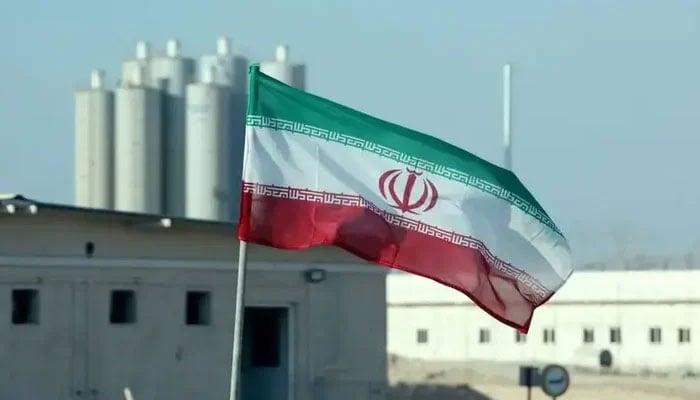 A picture taken on November 10, 2019 shows an Iranian flag at Irans Bushehr nuclear power plant. — AFP