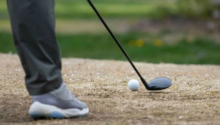 This representational image shows a person playing Golf. — AFP/File