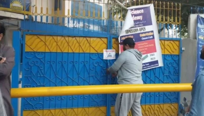 This still taken from a video released on October 30, 2023, shows an LDA official sealing a commercial premises. — Facebook@LahoreDevelopmentAuthority