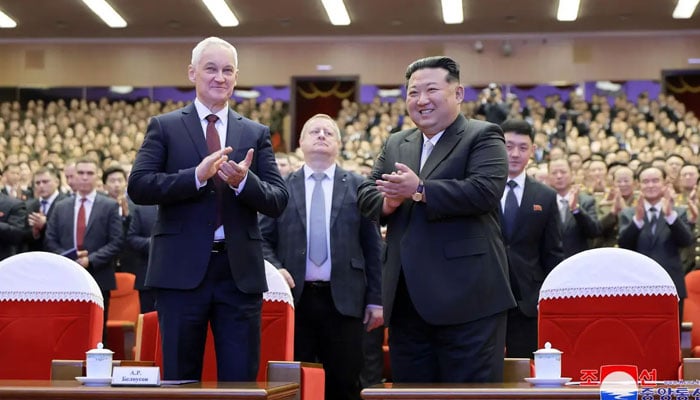 This picture taken on November 29, 2024 shows North Korean leader Kim Jong Un (right) watching a performance with Russias Minister of Defence Andrei Belousov  at House of Culture in Pyongyang. —AFP