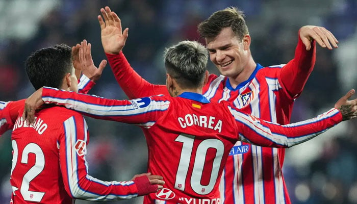 Atletico Madrid’s Norwegian forward Alexander Sorloth (right) celebrates scoring their fifth goal during the Spanish league football match between Real Valladolid FC and Club Atletico de Madrid at the Jose Zorrilla stadium in Valladolid on November 30, 2024. — AFP