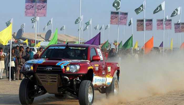 This representational image shows a car steering through the desert at a jeep rally in Pakistan on February 21, 2024. — APP