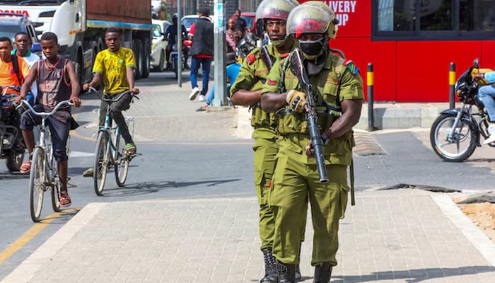 Tanzania riot police officers walk during the protests to condemn a series of kidnappings and murders in Dar es Salaam, Tanzania, September 23, 2024. — Reuters