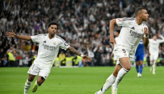 Real Madrids French forward Kylian Mbappe (right) celebrates scoring his teams second goal. — AFP/File