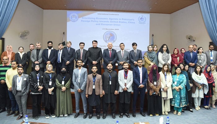 Participants pose for a photo at a two-day international conference titled ‘Prioritising Economic Agenda in Pakistan’s Foreign Policy Towards the United States, China, and the EU’ at NUML on December 2, 2024. — Facebook@NUMLOFFICIALPAGE