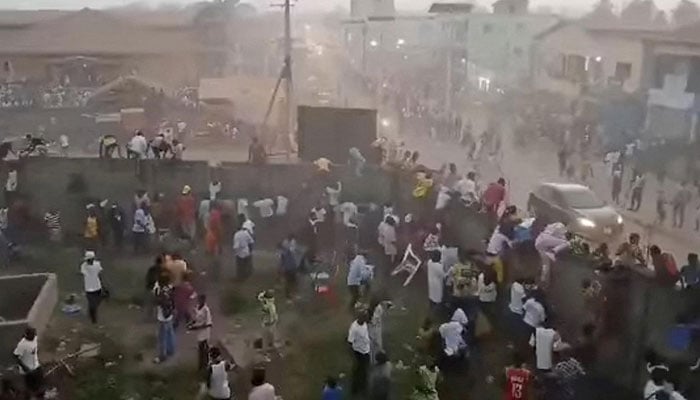 People scrambling in Nzerekore, Guinea, where local officials said a deadly stampede ensued at a stadium following fan clashes during a football match on Dec 1, 2024, in this still image obtained from a social media video. — Reuters