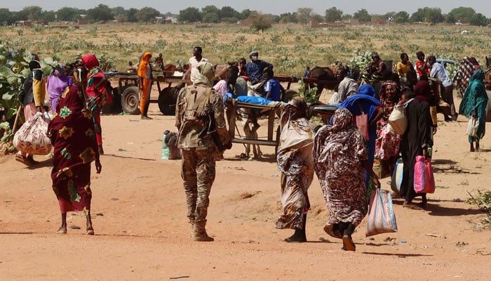 Families escaping Ardamata in West Darfur cross into Adre, Chad, after a wave of ethnic violence, November 7, 2023. Survivors recounted executions and looting in Ardamata, which they said were carried out by RSF and allied Arab militias. — Reuters