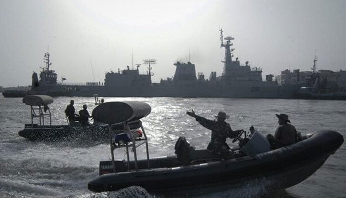 Pakistan Navy personnel keep guard near the Navy ship PNS Zulfiqar after it returned to Karachi in this June 23, 2011 file photo. — Reuters