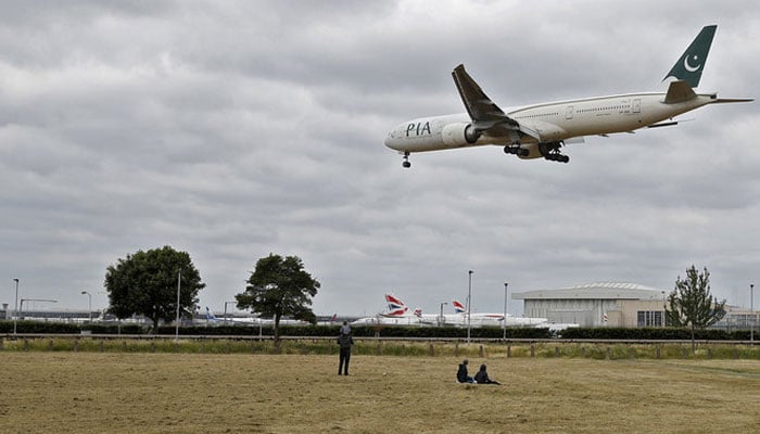 A Pakistan International Airlines Boeing 777 comes into land at Heathrow airport in west London. — AFP/File