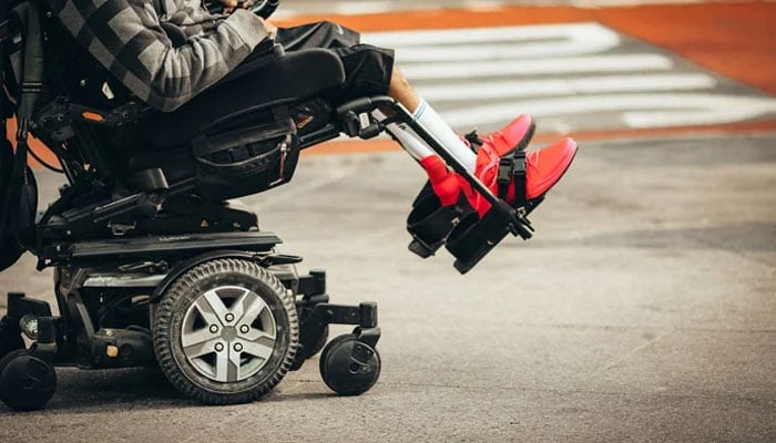 This representational image shows a disabled child sitting in an electric wheelchair. — Unsplash/File